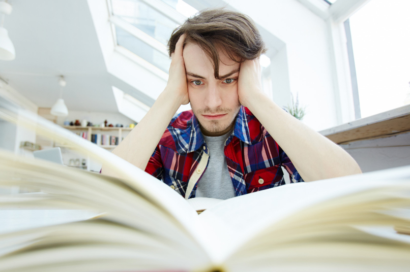 image of frustrated man studying for a test
