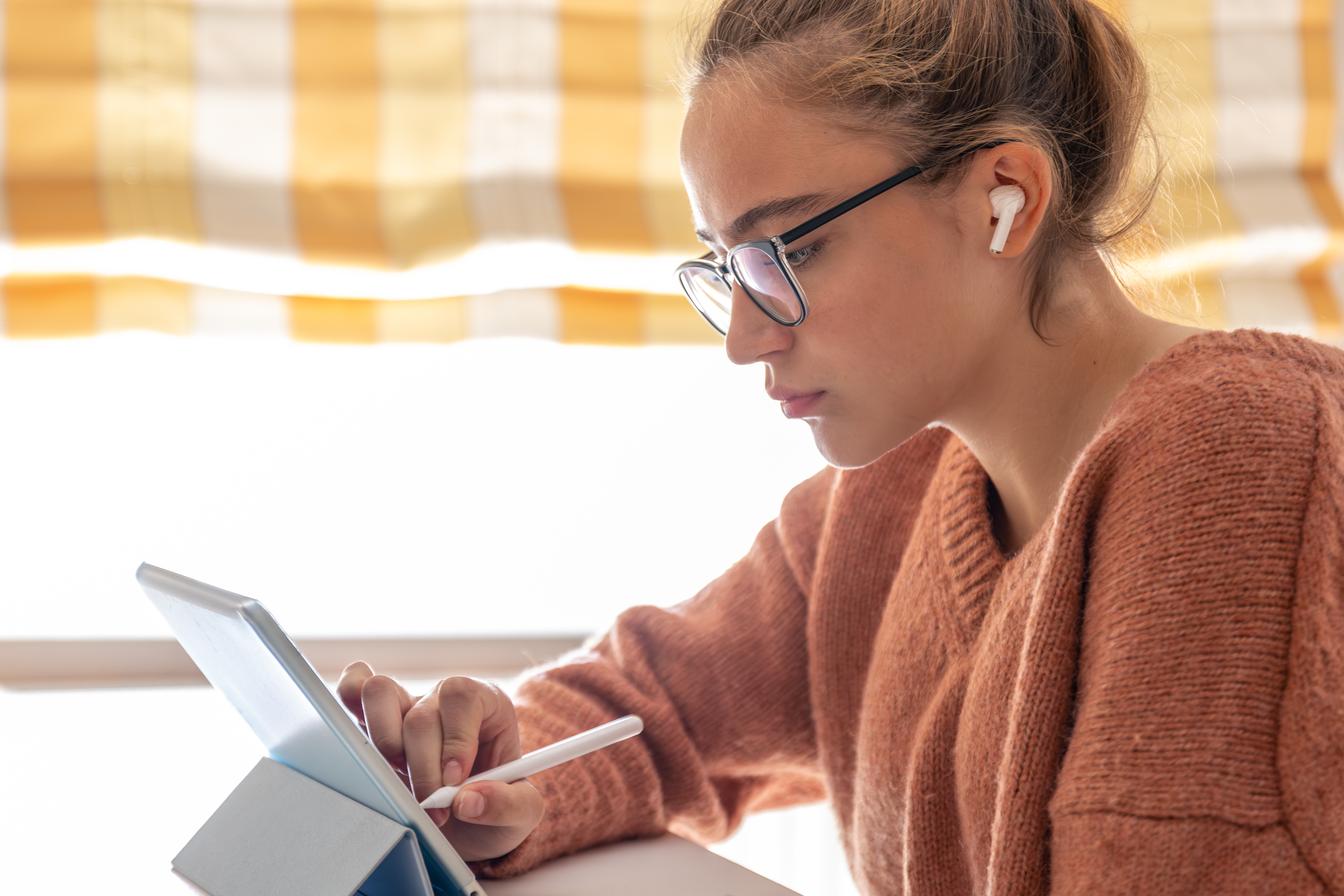 person studying on tablet